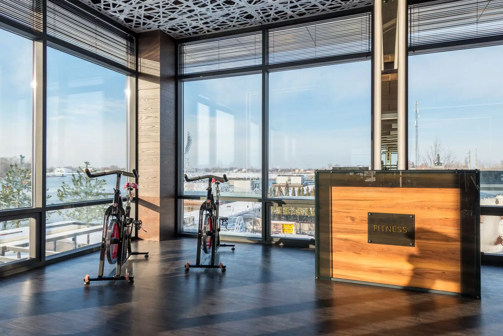 Reception desk and exercise bikes inside a modern gym